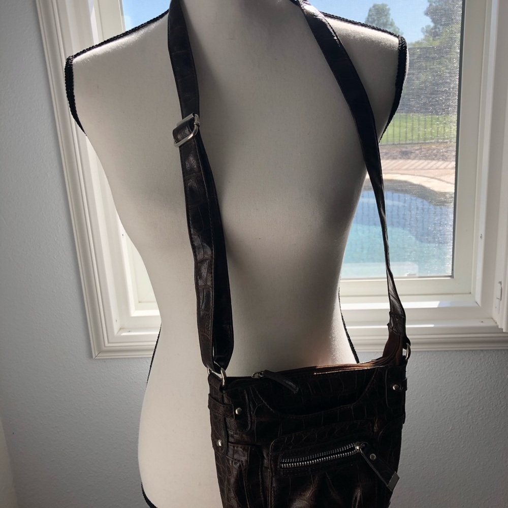 Brown crocodile print crossover purse.